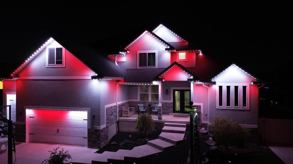 Aerial view of home with permanent LED roofline lighting