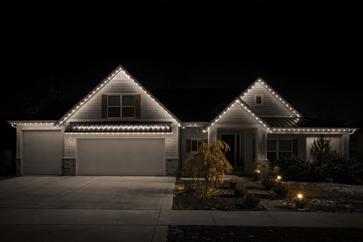 Single story home with clean warm white LED roofline lighting