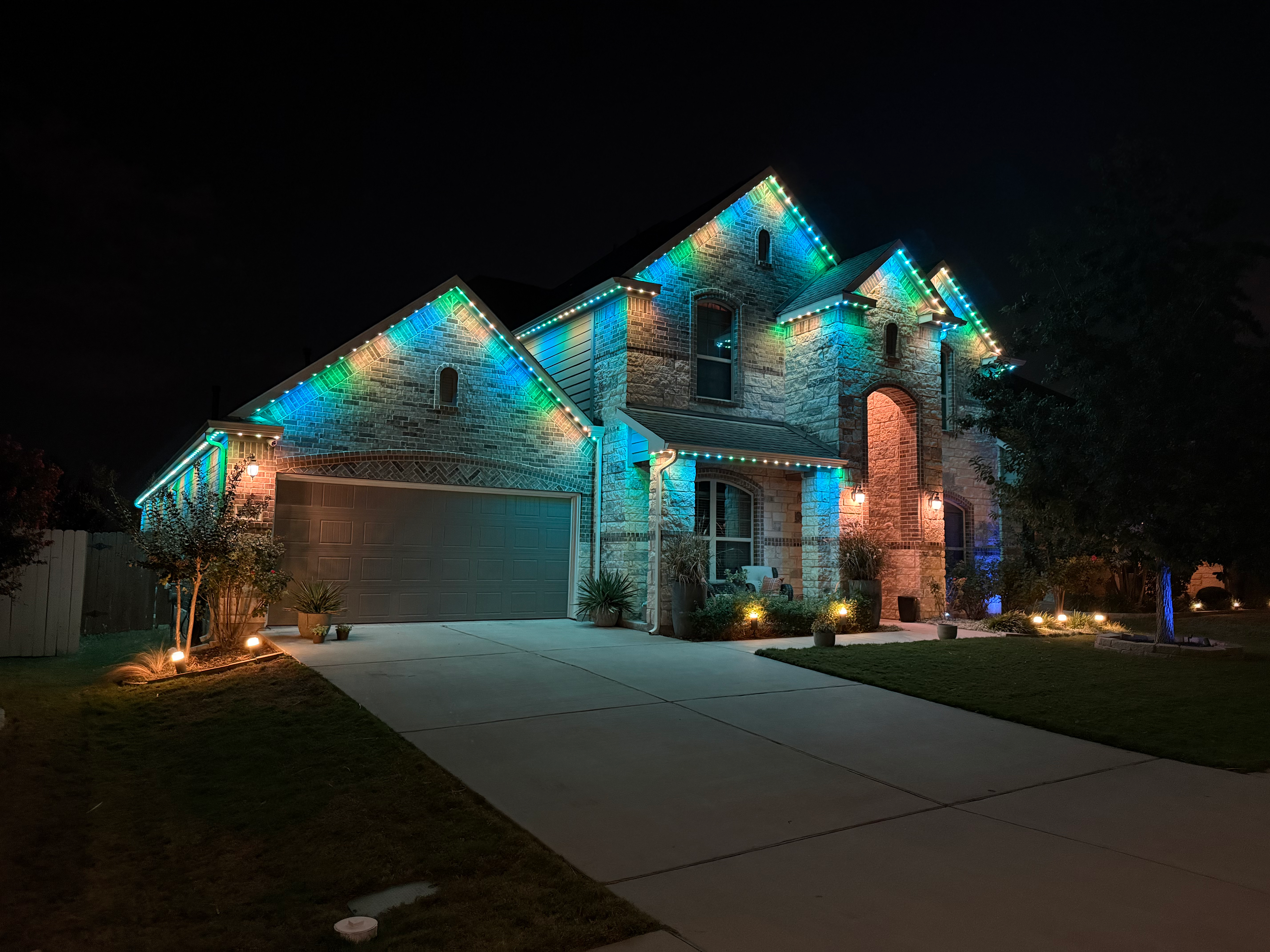 TruLight manufacturer example: Stone home with cool and warm white permanent lighting